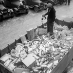 Prohibition agent stands in a flatbed of confiscated alcohol at the Trumbull Street Police Station in Detroit, Michigan