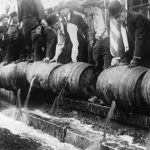 Police emptying kegs of alcohol
