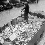 Prohibition agent stands in a flatbed of confiscated alcohol at the Trumbull Street Police Station in Detroit, Michigan