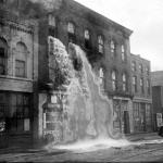 A distillery in Detroit discovered by prohibition agents who destroyed equipment, causing alcohol to pour out of windows