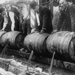 Police emptying kegs of alcohol